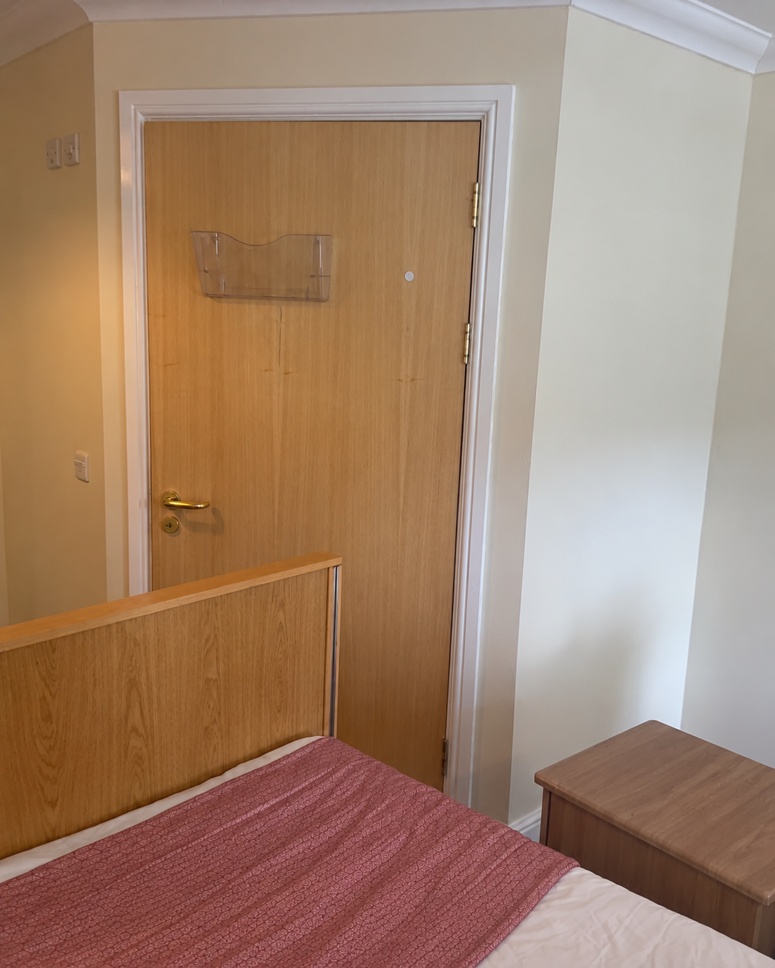 Care centre bedroom doorway redecorated in Dulux Trade Diamond Matt